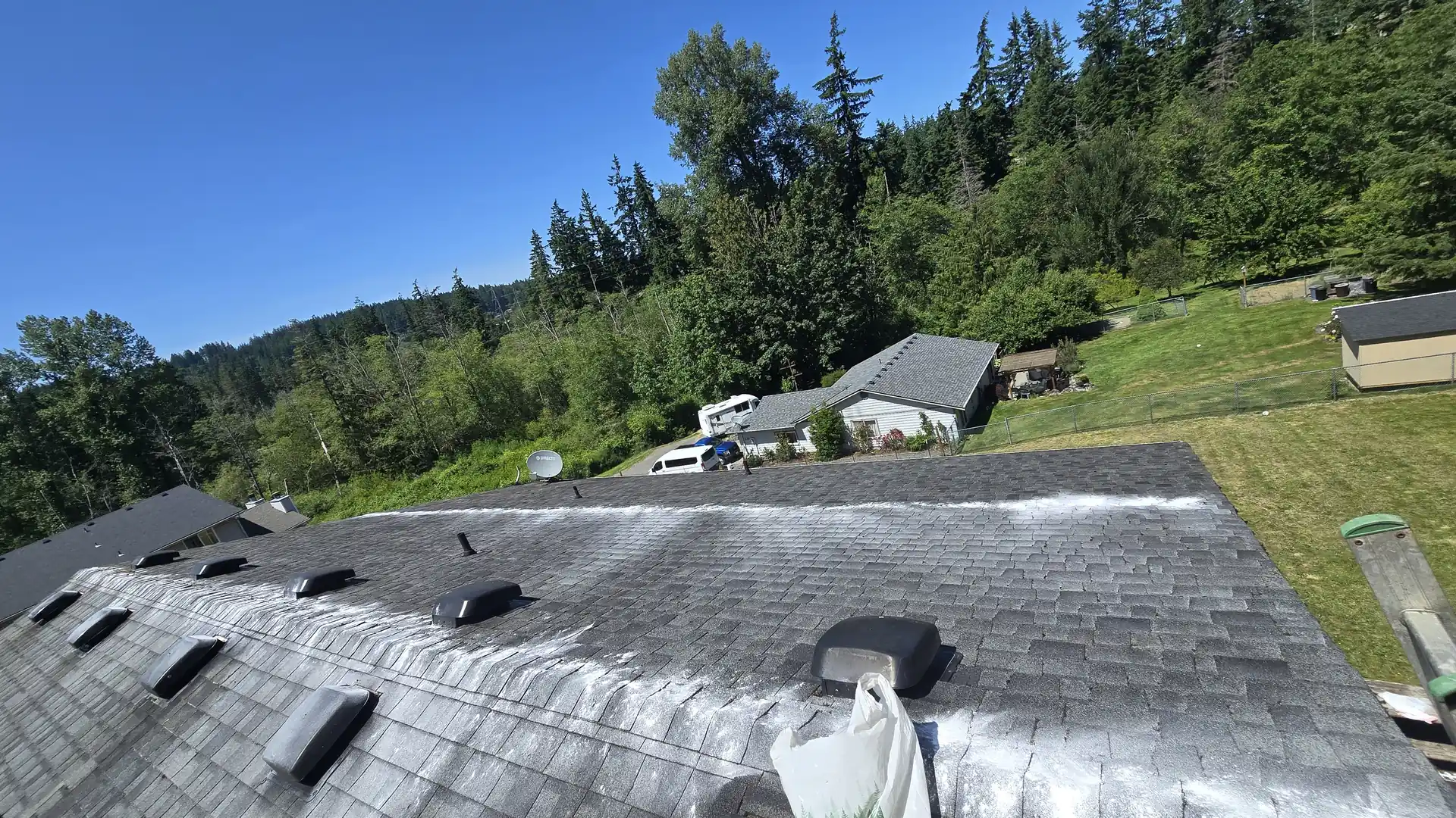 Moss removal and roof cleaning work by Saratoga Home Services & Landscaping on Camano Island